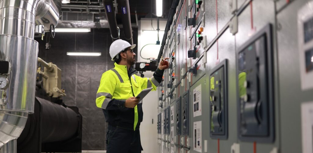 engineers working in the main control room of a state of the art chiller hvac system.
